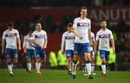 MANCHESTER, ENGLAND - JANUARY 29:  Dan Burn (33) of Wigan Athletic look dejected after defeat in the Emirates FA Cup Fourth round match between Manchester United and Wigan Athletic at Old Trafford on January 29, 2017 in Manchester, England.  (Photo by Laurence Griffiths/Getty Images)
